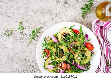 Diet menu. Healthy salad of fresh vegetables - tomatoes, avocado, arugula, radish and seeds on a bowl. Vegan food. Flat lay. Top view - Shutterstock ID 1160199016