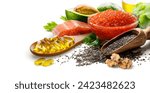 Diet and omega 3 nutritional supplements concept of fish oil capsules in wooden spoon and food rich in omega 3 fatty acids on white background..