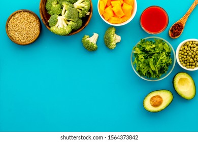 Diet program concept. Set of fresh vegatables and fruits on blue background top view frame copy space