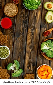 Diet program concept. Set of fresh vegetables and fruits on dark wooden background top view frame copy space