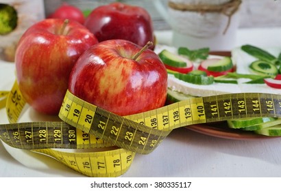 Diet - Slimming .Weight Loss Concept With Red Apple, Vegetables And Dairy Products .