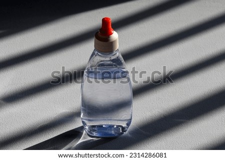 diet sweetener bottle on window light background with shadow