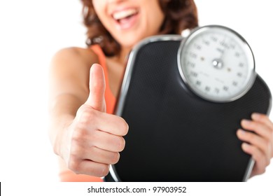 Diet And Weight - Young Woman With A Scale, She Is Happy About The Success