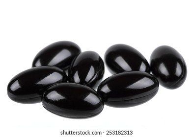 Dietary supplement capsules in black
