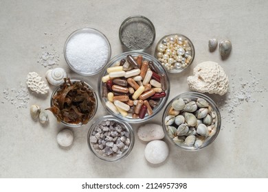 Dietary supplements or medicines from sea minerals in capsules, salt, clay, algae and shells - Shutterstock ID 2124957398