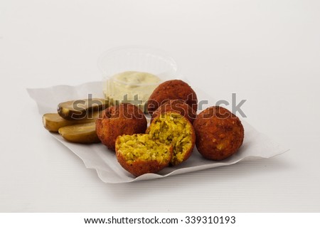 Dietetic falafel on a plate with sauce and pickles on a white background closeup (not isolated). Copy space Stock photo © 