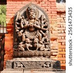 Diety of Ugrabhairav,manifestation of the Furious Hindu God Shiva, granite stone idol along the Basantpur palace wall in the historic heritage town of Bhaktapur,Nepal