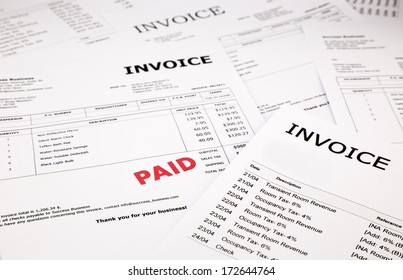 Difference Invoices And Bills With Red Paid Stamp, Concept And Ideas