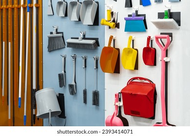 difference type home and garden tool hanging on board such as dustpan mob etc.