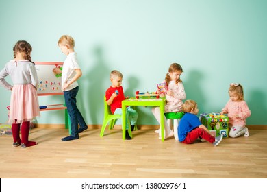 Different Age Kids At Homeschooling At Home Or Daycare.