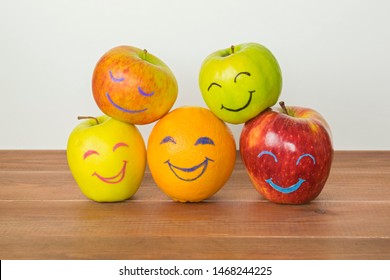 Different Apples And Orange With Funny Faces, Tolerance, Originality Or Friendship Concept. 