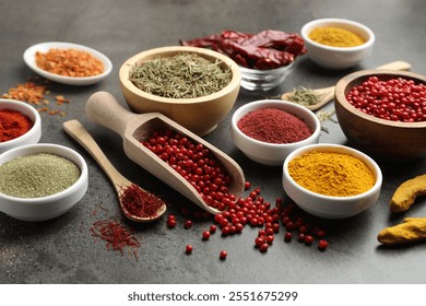 Different aromatic spices on grey table, closeup - Powered by Shutterstock