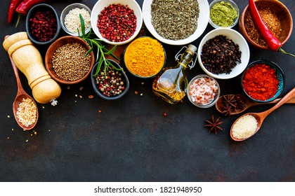 Different assortment of spices on black stone background. Top view.  - Shutterstock ID 1821948950