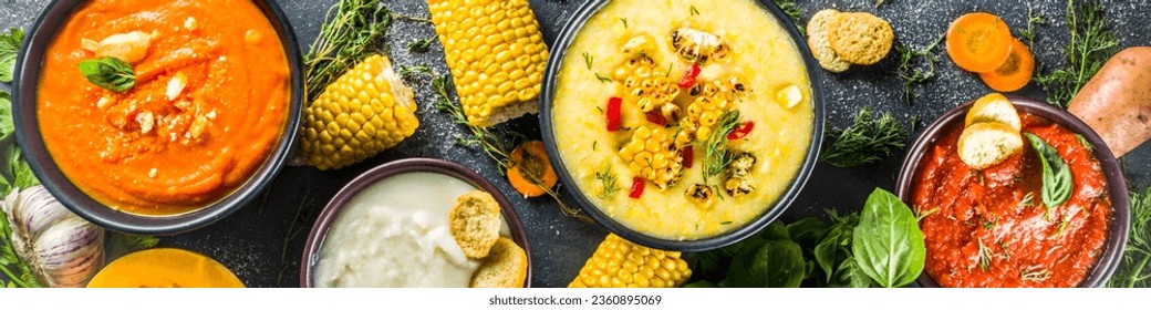 Different autumn soups set. Assortment vegetable soups in portion bowls - corn, potato, pumpkin, tomato, zucchini, broccoli cream soups. On black concrete background top view copy space - Powered by Shutterstock