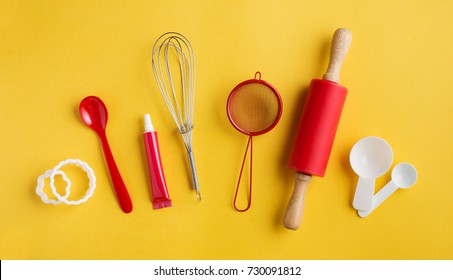 Different Baking Tools On Yellow Background, Top View. Baking And Cooking Concept