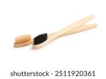 Different bamboo toothbrushes on white background