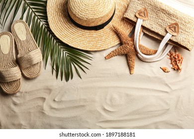 Different Beach Accessories On Sand, Flat Lay. Space For Text