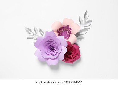 Different beautiful flowers and branches made of paper on white background, top view