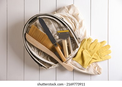 Different Beekeeping Tools On White Wooden Table, Flat Lay