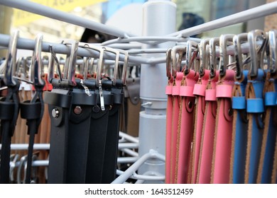 Different Belts Hang On A Clothes Rail