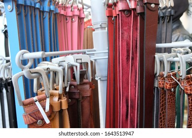 Different Belts Hang On A Clothes Rail