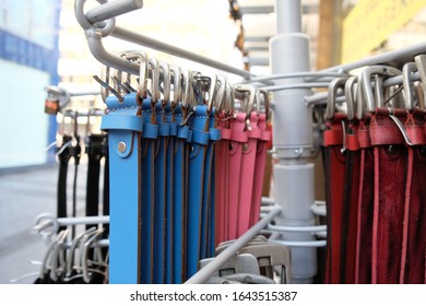 Different Belts Hang On A Clothes Rail