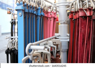 Different Belts Hang On A Clothes Rail