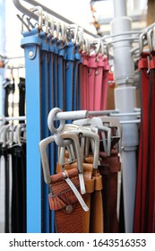 Different Belts Hang On A Clothes Rail