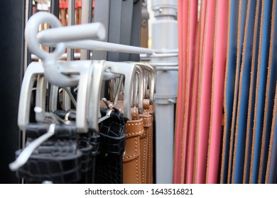 Different Belts Hang On A Clothes Rail