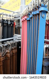 Different Belts Hang On A Clothes Rail