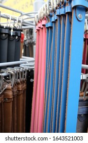 Different Belts Hang On A Clothes Rail