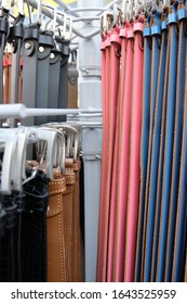 Different Belts Hang On A Clothes Rail