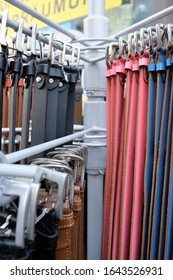 Different Belts Hang On A Clothes Rail