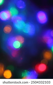 different blurred multicolor light spots. new year holiday background