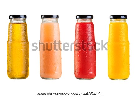 different bottles of juice on white background