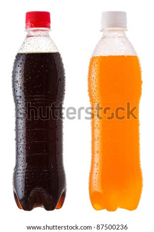 different bottles of soda on white background