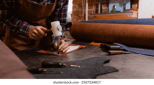 Different brown rolled leather with tool in shoemaker workshop, banner background tailor footwear. - Powered by Shutterstock