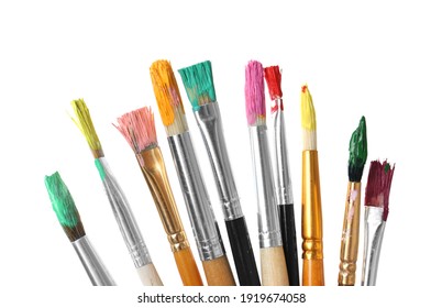 Different brushes with paints on white background - Powered by Shutterstock