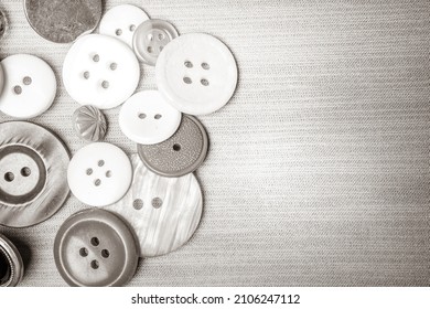 Different buttons on a background made of fabric