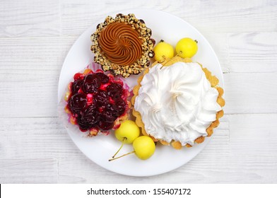 Different cake in a plate on table. Top view - Powered by Shutterstock