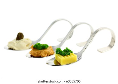 Different canapes. Shallow depth of field. Isolated on white background. Studio work.