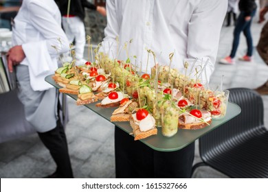 A Lot Of Different Canapes And Snacks On A Tray That The Waiter 