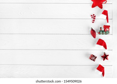 Different christmas objects lay out on white wooden background. Winter holidays. New Year greeting card