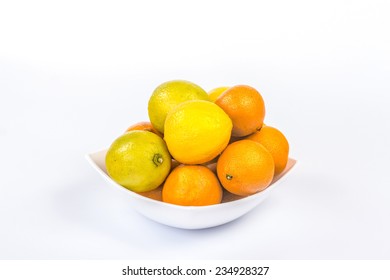 A Lot Of Different Citrus Fruits In A White Bowl