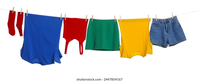 Different clothes drying on laundry line against white background - Powered by Shutterstock