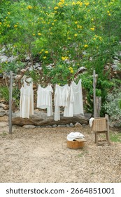 Different clothes drying on laundry line against garden background,clothes hanging laundry on washing line for drying towels drying on the clothesline.