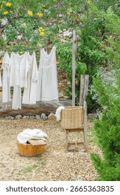 Different clothes drying on laundry line against garden background,clothes hanging laundry on washing line for drying towels drying on the clothesline.