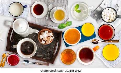 Different Cold And Hot Drinks On Wooden Table. Tea, Milk, Juice,coffee, Smoothie, Water, Pot, Tray And Tissue. Concepts Of Healthy Traditional Tasty Drinks.