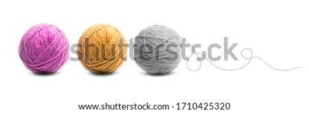 Different color balls of threads wool yarn isolated on white background