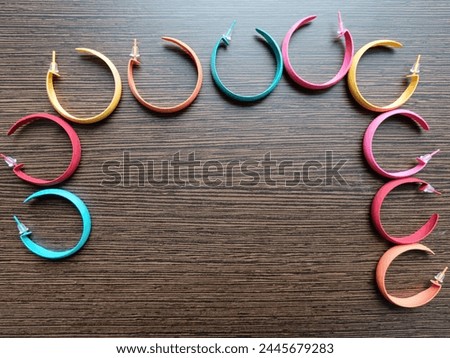 Different color collection of metal earrings. 